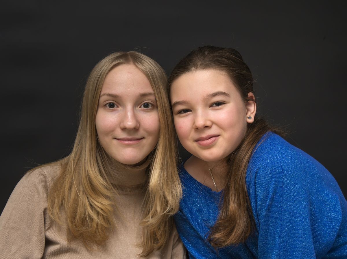 Portrait of an older and a younger sister